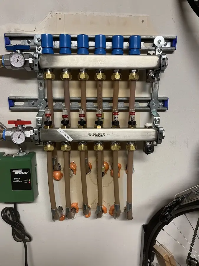 Plumber performing Water Heater Repair at a residential property in Locust